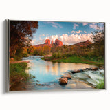 Framed canvas wall art showcasing a serene landscape with rocks and natural elements, highlighted by a sleek silver frame, perfect for home decor.