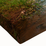 Close-up of a stretched canvas wall art featuring a vibrant landscape with rocky formations in earthy tones, ideal for home decor and interior design.