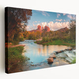 Stretched canvas wall art showcasing a stunning landscape of rocky mountains under a vibrant sunset, perfect for enhancing modern home decor. Rich colors and detailed textures make it an eye-catching focal point for any room.