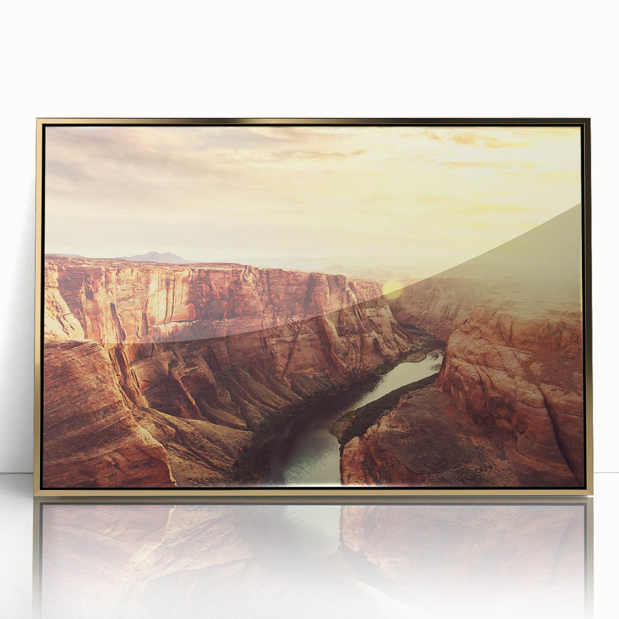 Framed acrylic wall art showcasing a striking landscape design featuring rocks and natural elements, with a gold frame accentuating its elegance. Perfect for home decor.