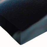 Close-up of a stretched canvas wall art piece showcasing a vibrant abstract landscape design featuring textured rock formations in earthy tones, ideal for modern home decor.