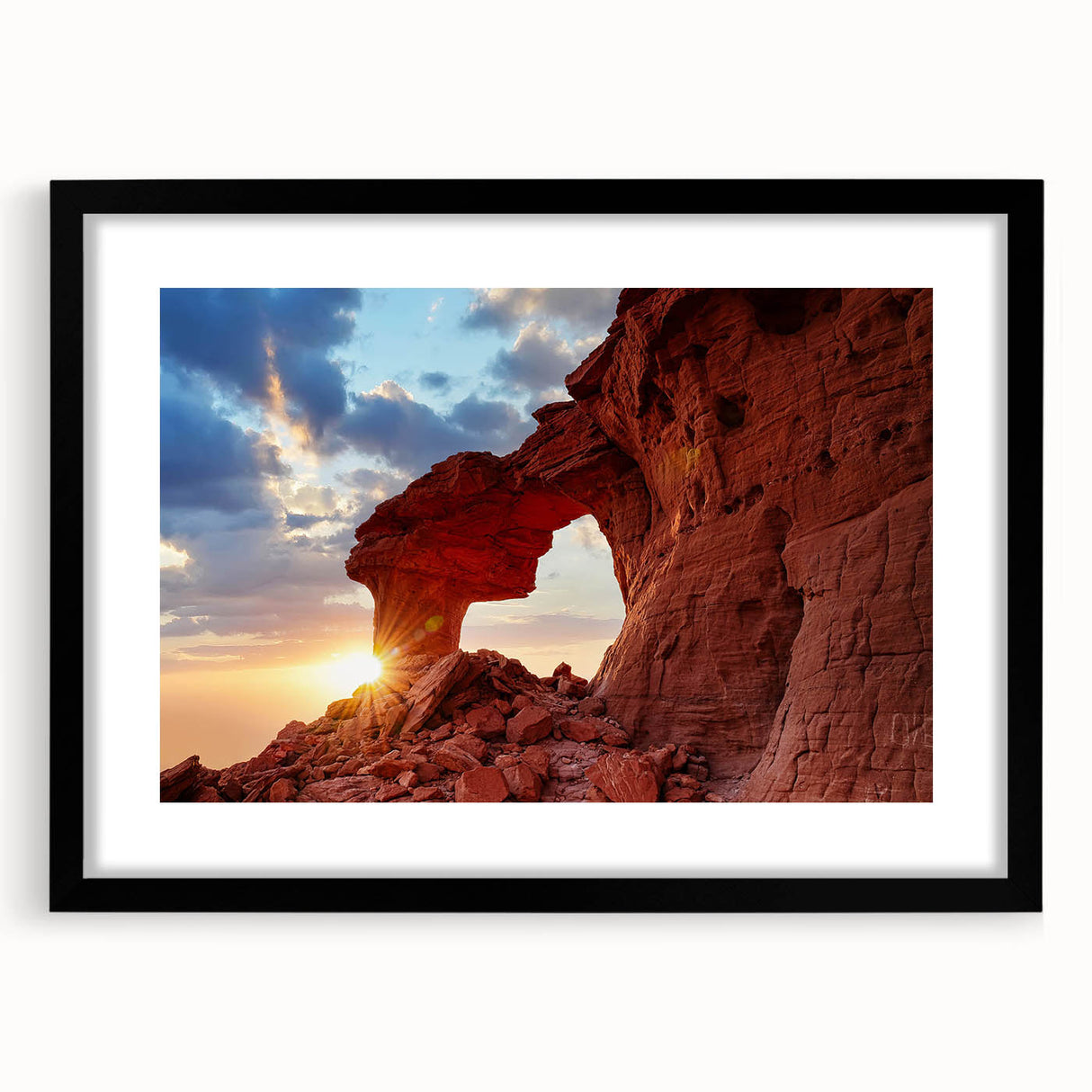Framed landscape wall art showcasing a serene rocky terrain scene with vibrant colors, featuring a sleek black frame and white mat, perfect for home decor.