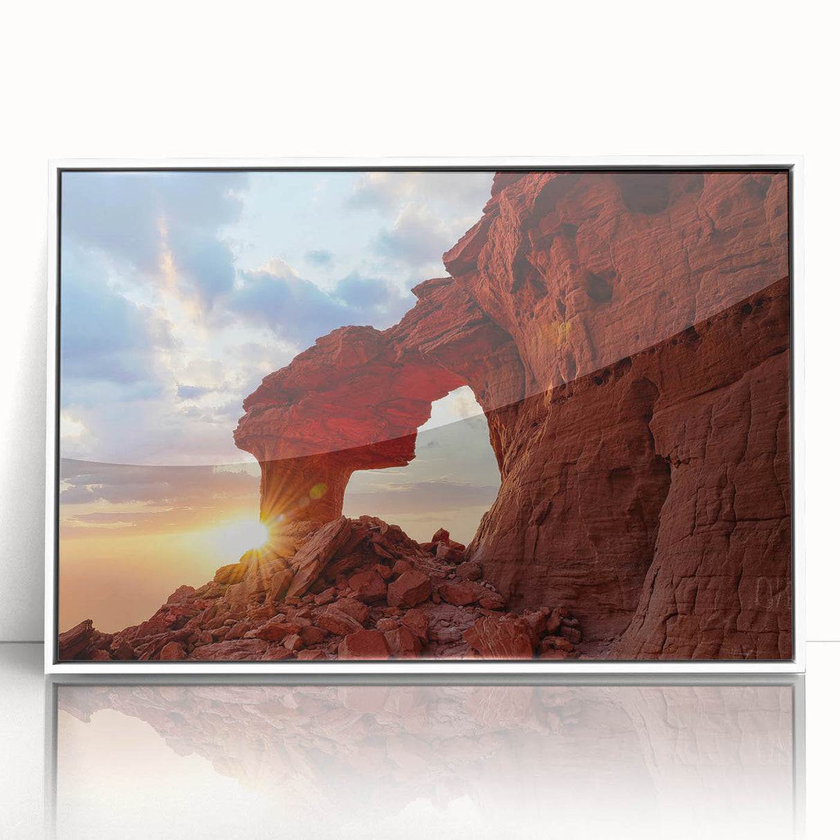 Framed acrylic wall art featuring a serene landscape with rocky cliffs and vibrant blue sky, elegantly displayed in a sleek white frame, perfect for modern decor.