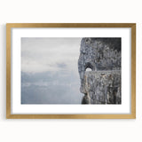 Framed wall art collection featuring a serene landscape design with rocks and greenery, set in an elegant gold frame with a white mat, ideal for home decor.