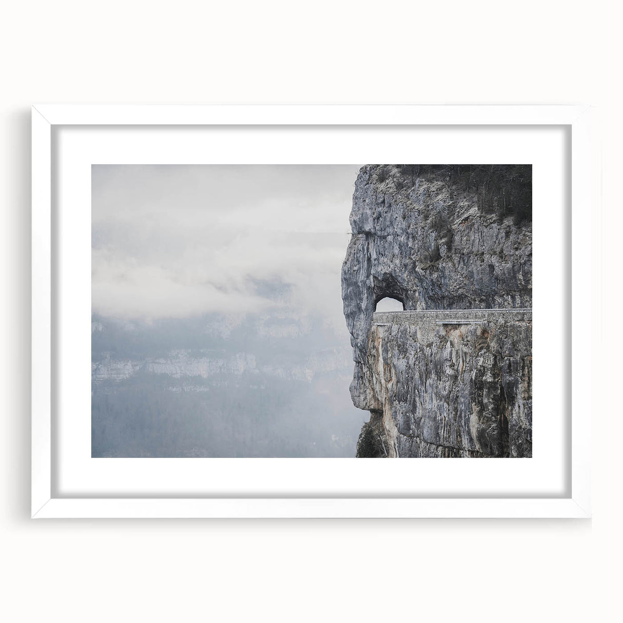 Framed wall art featuring a serene landscape design with textured rocks and soft colors, set in a white mat and sleek frame, perfect for home decor.