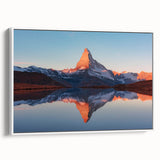 Framed canvas artwork of a serene landscape featuring rugged rocks and vibrant colors, displayed with a white frame, showcasing a modern wall art collection.
