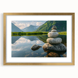 Framed wall art featuring a serene landscape with rocks and muted colors, elegantly presented with a gold mat, perfect for enhancing home decor.