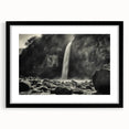 Framed wall art featuring a stunning landscape design with rocks and natural elements, set in a sleek black frame with a mat, ideal for modern home decor.