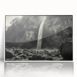 Framed acrylic wall art featuring a serene landscape of rocks and mountains, showcased in a sleek white frame, ideal for home or office decor. The artwork captures a tranquil natural scene, enhancing any interior space with its calming tones and detailed textures.