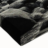 Close-up view of a stretched canvas wall art piece featuring a vibrant landscape design with intricate rock formations and earthy tones, perfect for home decor.