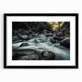 Framed wall art showcasing a serene landscape with rocky formations, featuring a black frame and mat, ideal for modern home decor and interior design enthusiasts.