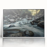 Framed acrylic wall art showcasing a stunning landscape with rocky formations, featuring a white frame that enhances the natural colors and textures, ideal for home decor.