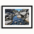 Black-framed wall art showcasing a serene landscape with rocks and a vibrant sky, ideal for enhancing modern home decor aesthetics. Perfect for living rooms or offices.