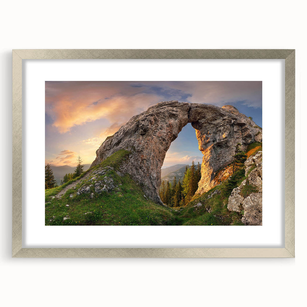Framed wall art showcasing a vibrant landscape design featuring rocky formations and natural scenery, set in an elegant silver frame with a mat for a polished look.