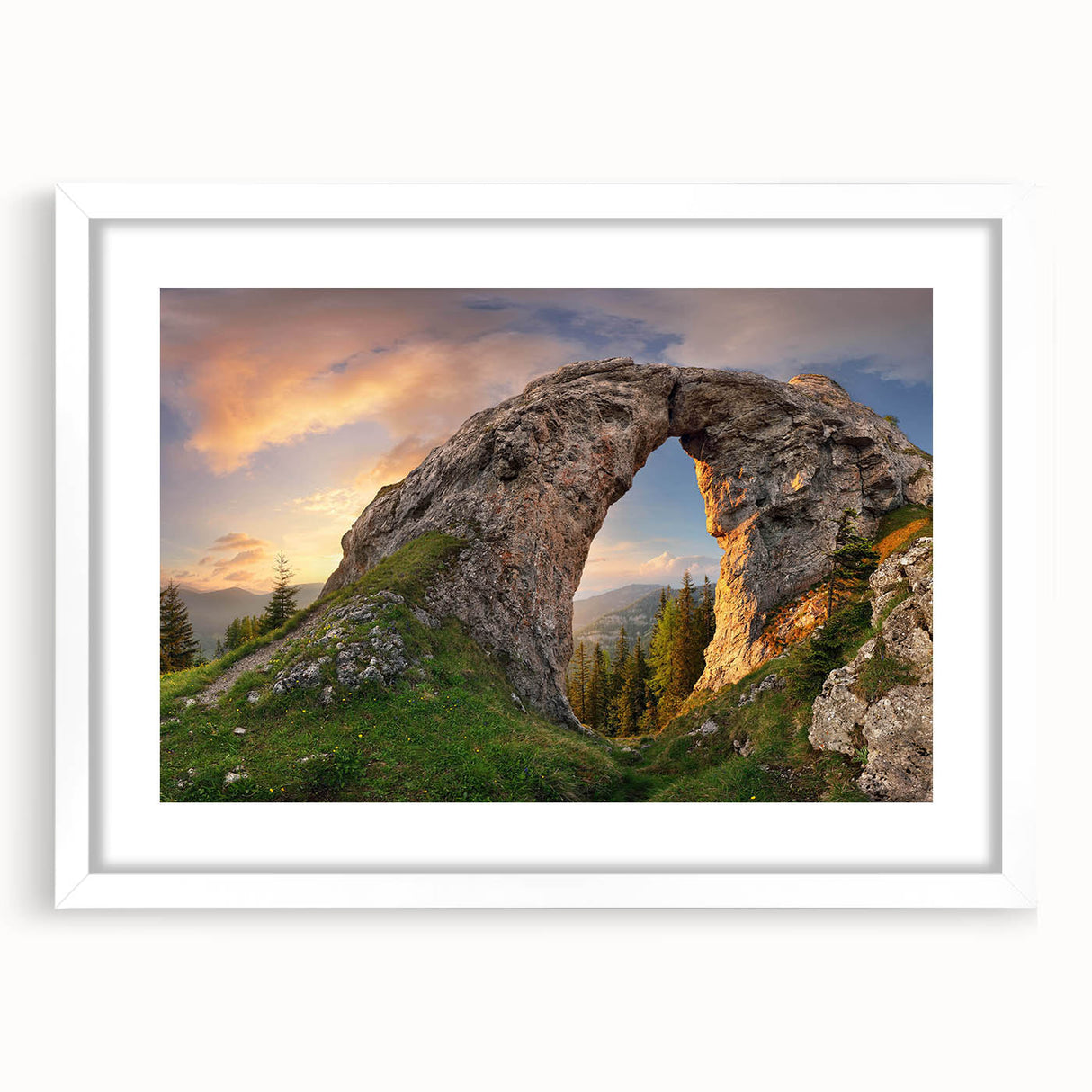 Framed wall art showcasing a serene landscape with intricate rock formations, set in a stylish white matte frame, perfect for enhancing home decor.