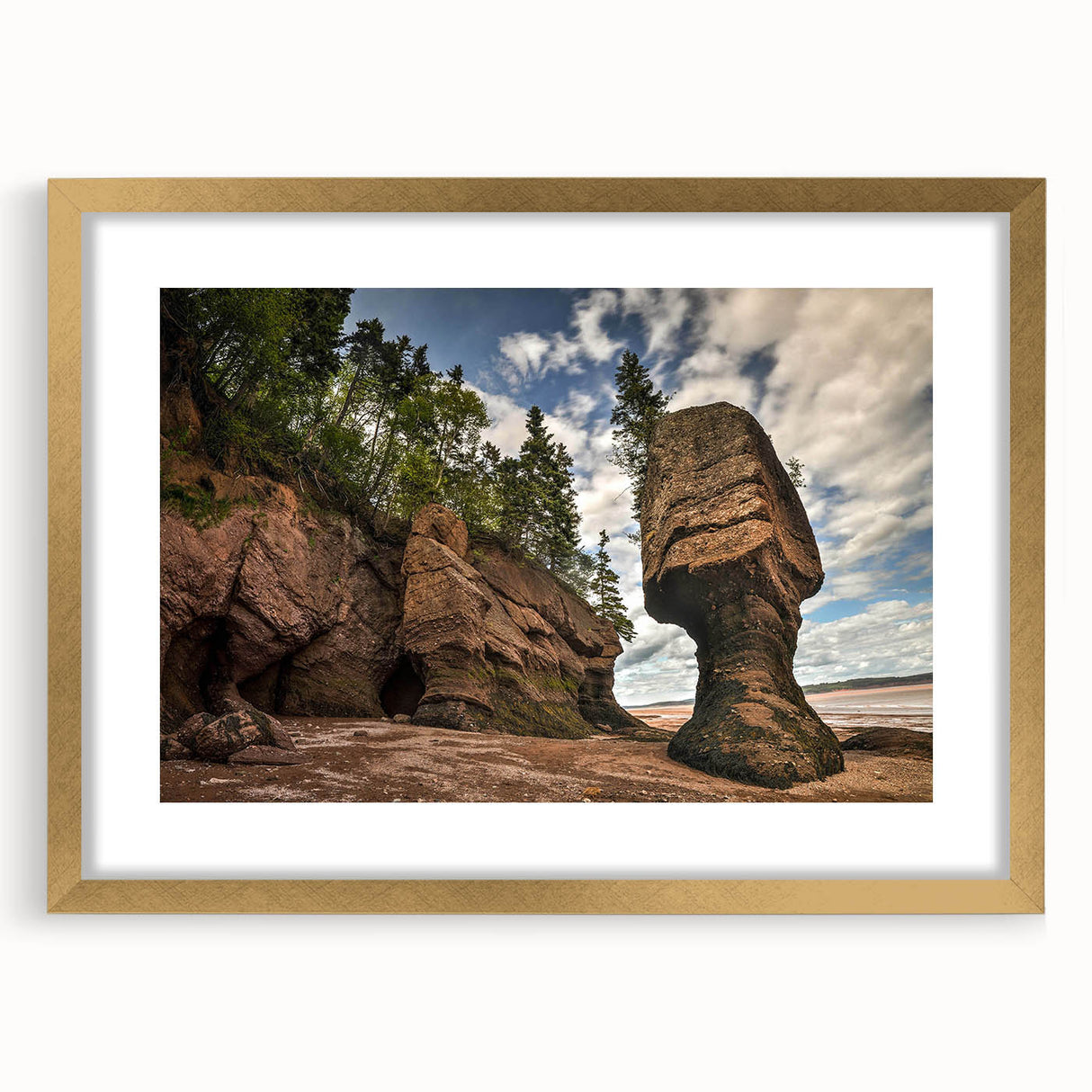 Framed wall art featuring a stunning landscape design with rocks, set in an elegant gold frame and matting, perfect for enhancing modern home decor.