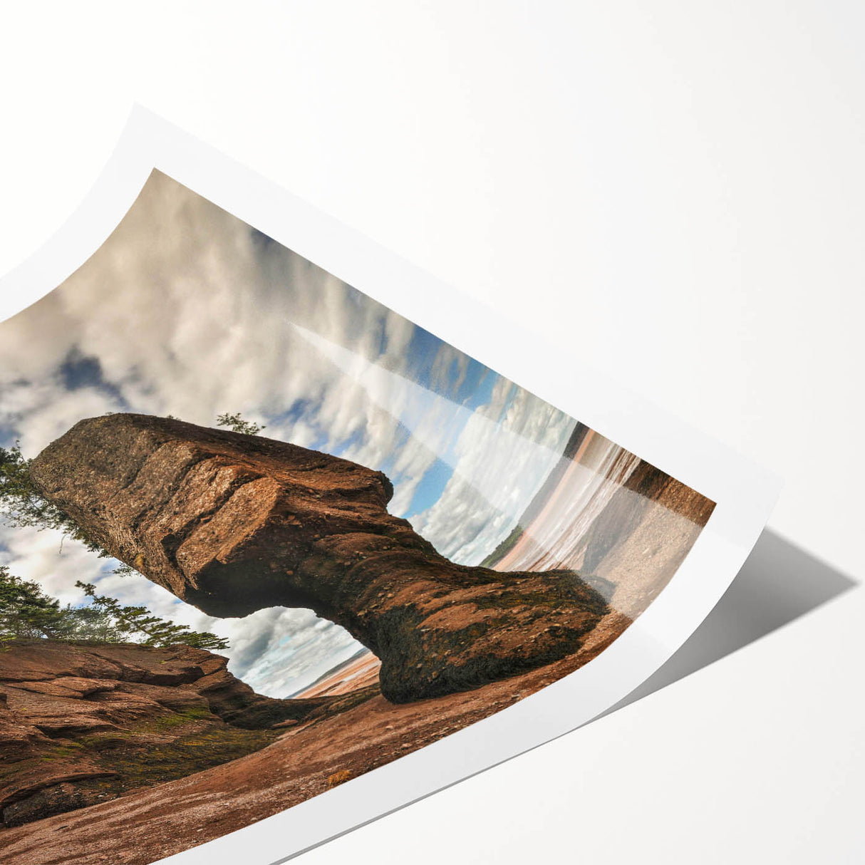 Abstract landscape wall art print showcasing vibrant rocky formations in earthy tones, rolled for shipping in a protective cardboard tube, ideal for home decor.