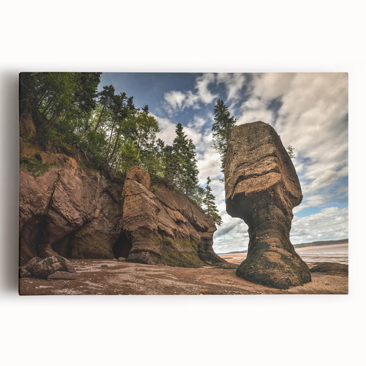 Stretched canvas wall art showcasing a serene landscape design with rocky formations and vivid green foliage, perfect for home decor. Ideal for nature lovers and art enthusiasts.