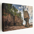 Stretched canvas wall art showcasing a serene landscape with rocky formations and vibrant colors, ideal for modern home decor. The side view highlights its depth and texture, making it a captivating focal point for any room.