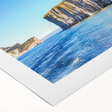 Rolled canvas artwork showcasing a vibrant landscape design with rocky formations, ideal for home decor, presented in a protective cardboard tube.