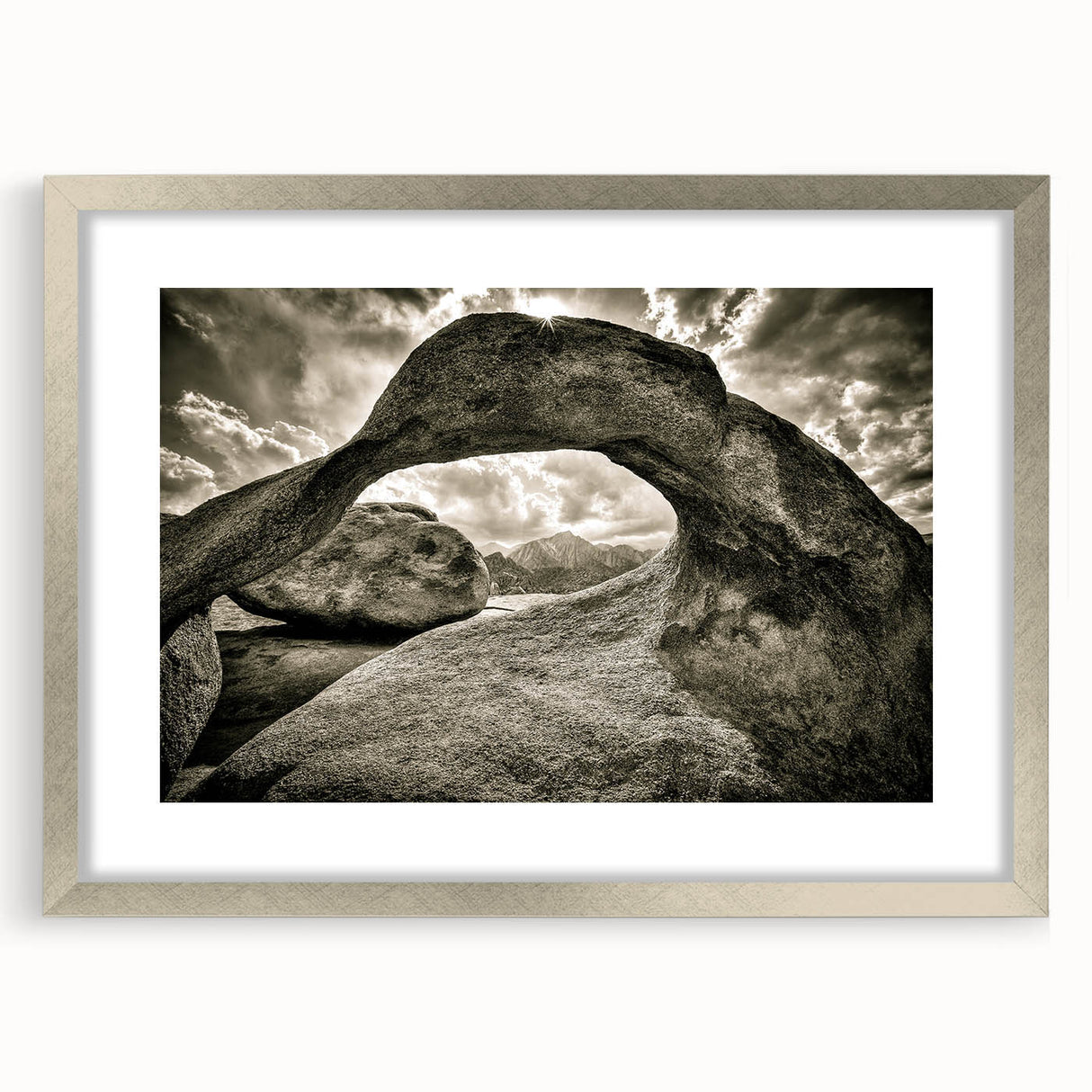 Framed wall art collection showcasing a serene landscape with rocks, presented in a silver frame with a mat, perfect for modern home decor.