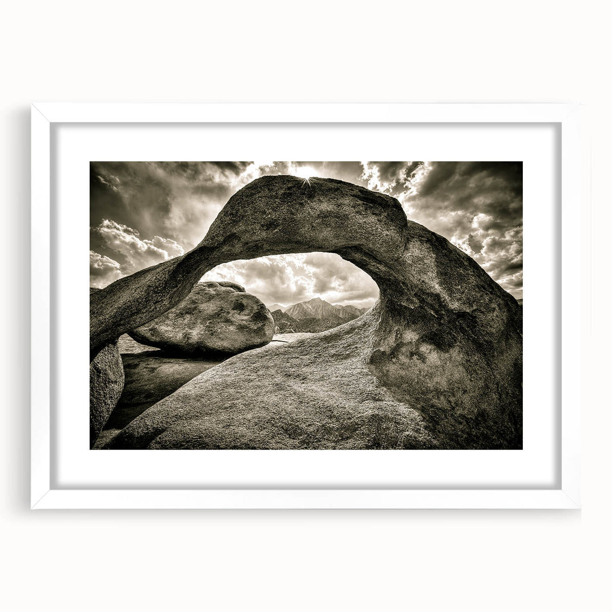 Framed wall art depicting a serene landscape with rocks and natural elements, featuring a white mat and a sleek frame, perfect for home decor enhancement.