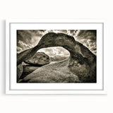 Framed wall art depicting a serene landscape with rocks and natural elements, featuring a white mat and a sleek frame, perfect for home decor enhancement.