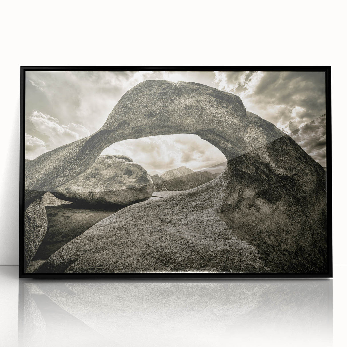Framed acrylic wall art featuring an abstract landscape design with vibrant colors and textured rocks, set against a sleek black frame for modern decor. Perfect for enhancing interior spaces with artistic flair.