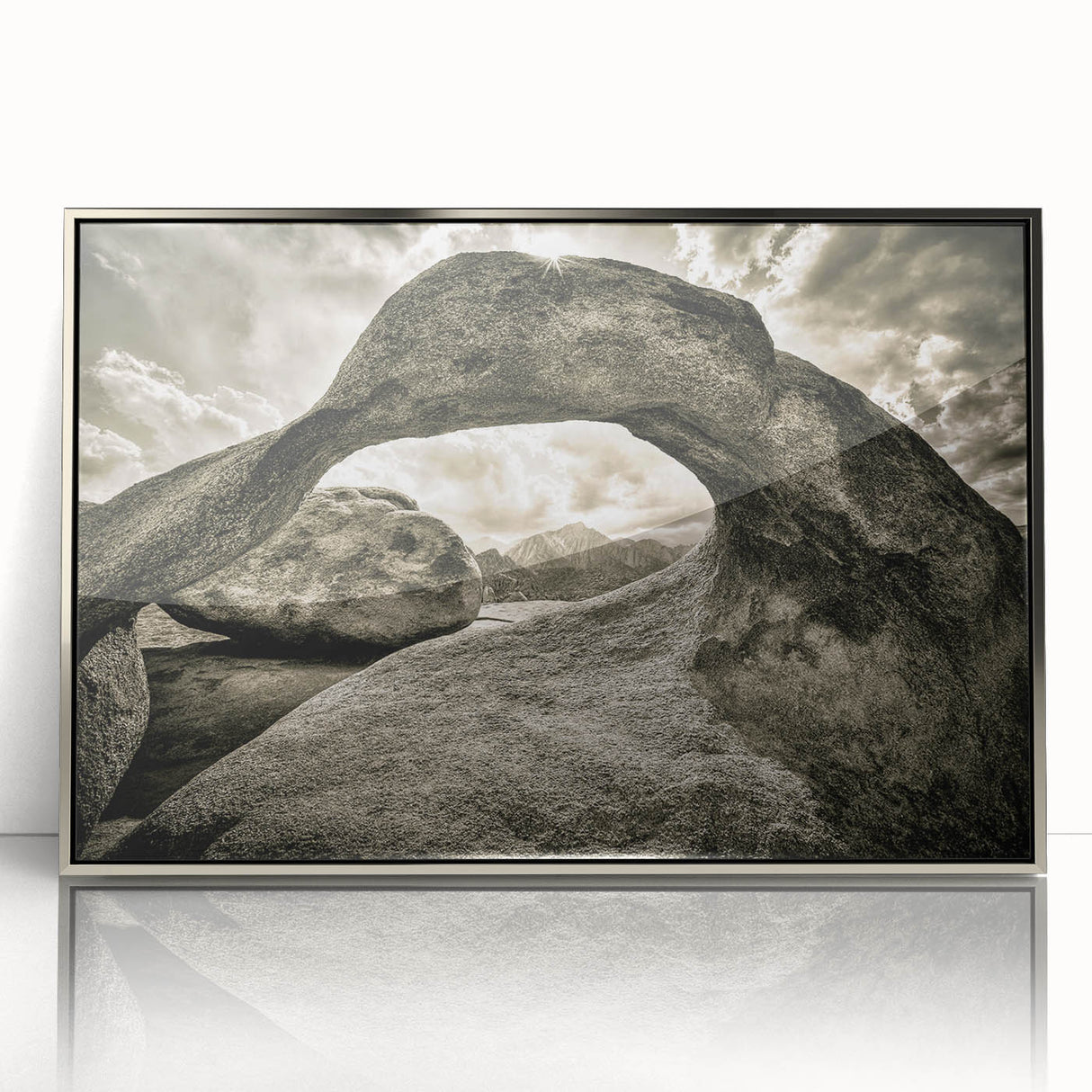 Framed acrylic wall art showcasing a modern landscape design with textured rocks, featuring a sleek silver frame, ideal for contemporary home decor.