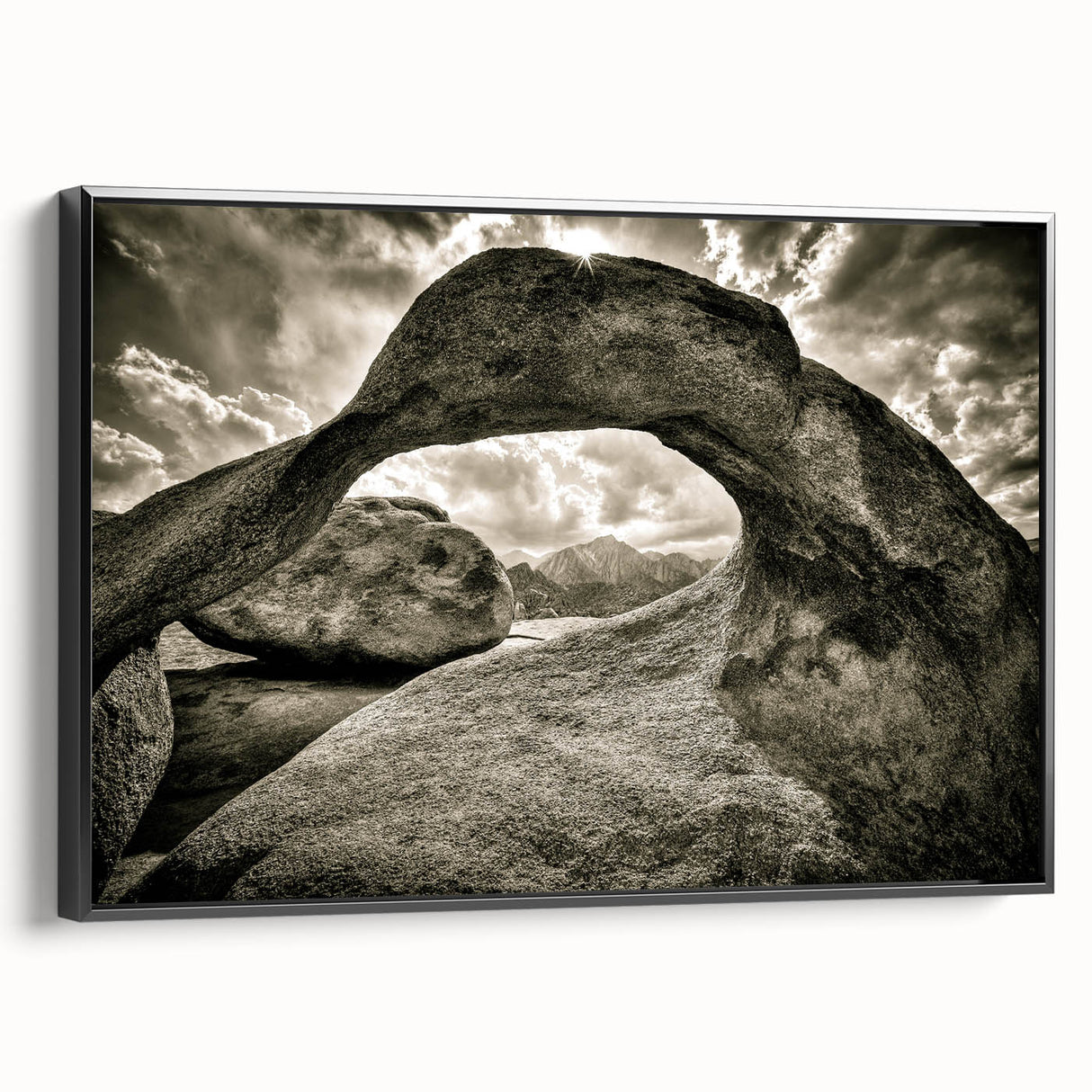 Framed canvas wall art showcasing a contemporary landscape design featuring textured rocks and earthy tones, presented in a sleek black frame for modern decor.