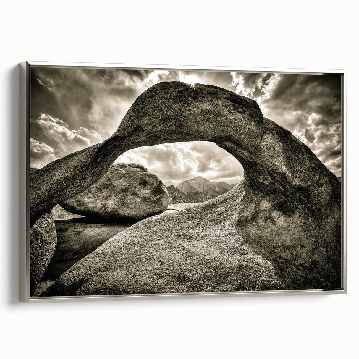 Framed canvas wall art showcasing a serene landscape with textured rocks, designed in a modern silver frame, enhancing any contemporary decor.