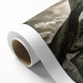 Rolled canvas artwork showcasing a serene landscape design with rocky cliffs and vibrant colors, elegantly packaged in a protective cardboard tube for safe shipping.