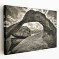 Stretched canvas wall art showcasing a tranquil landscape with rocky formations and soft pastel colors, adding a serene touch to any home decor.