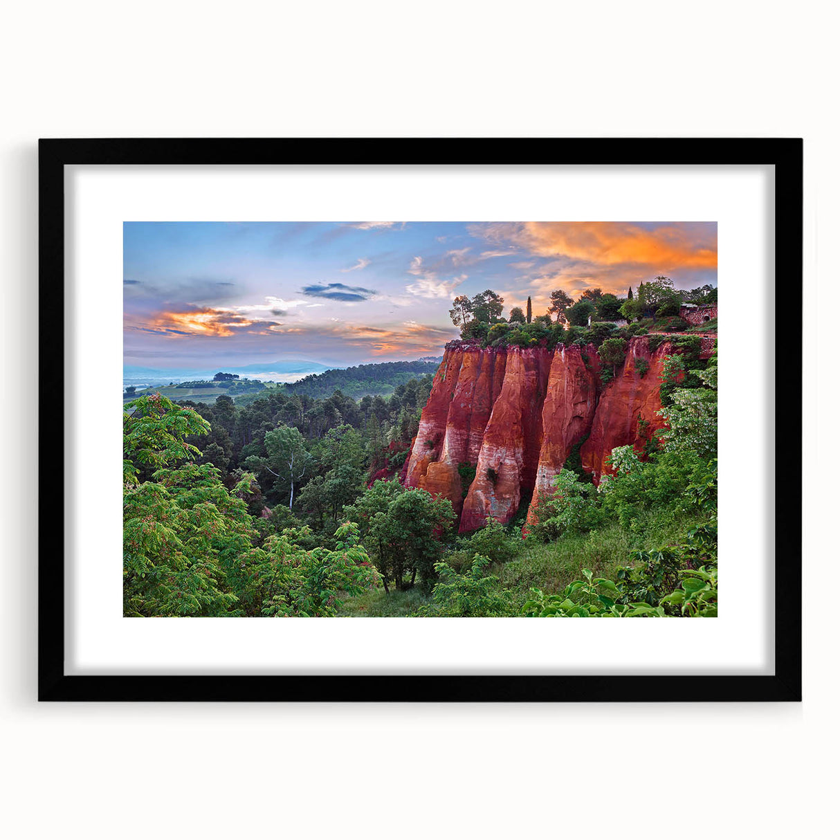 Framed wall art display featuring a serene landscape design with rocky formations and soft colors, set in a sleek black frame, ideal for modern home decor.