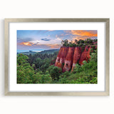 Framed wall art featuring a landscape design with rocky formations, presented in a sleek silver frame with a white mat, ideal for modern home decor.