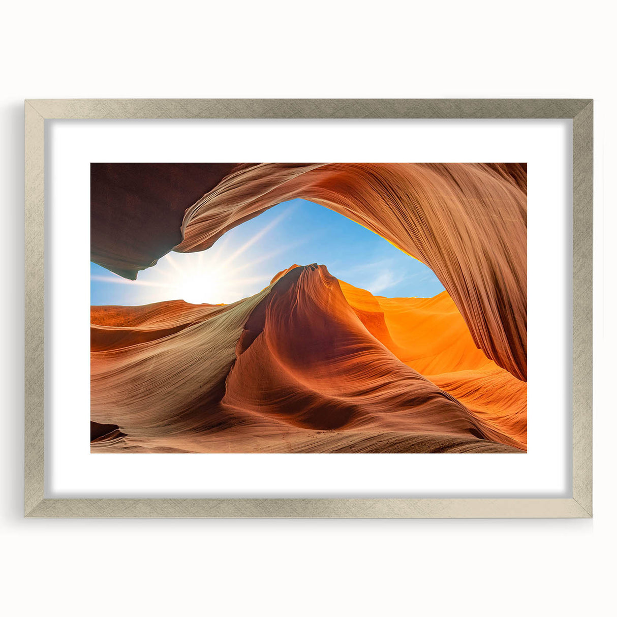 Framed wall art featuring a serene landscape with textured rocks and natural hues, elegantly presented with a silver mat and frame, perfect for home decor.