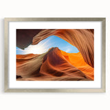 Framed wall art featuring a serene landscape with textured rocks and natural hues, elegantly presented with a silver mat and frame, perfect for home decor.