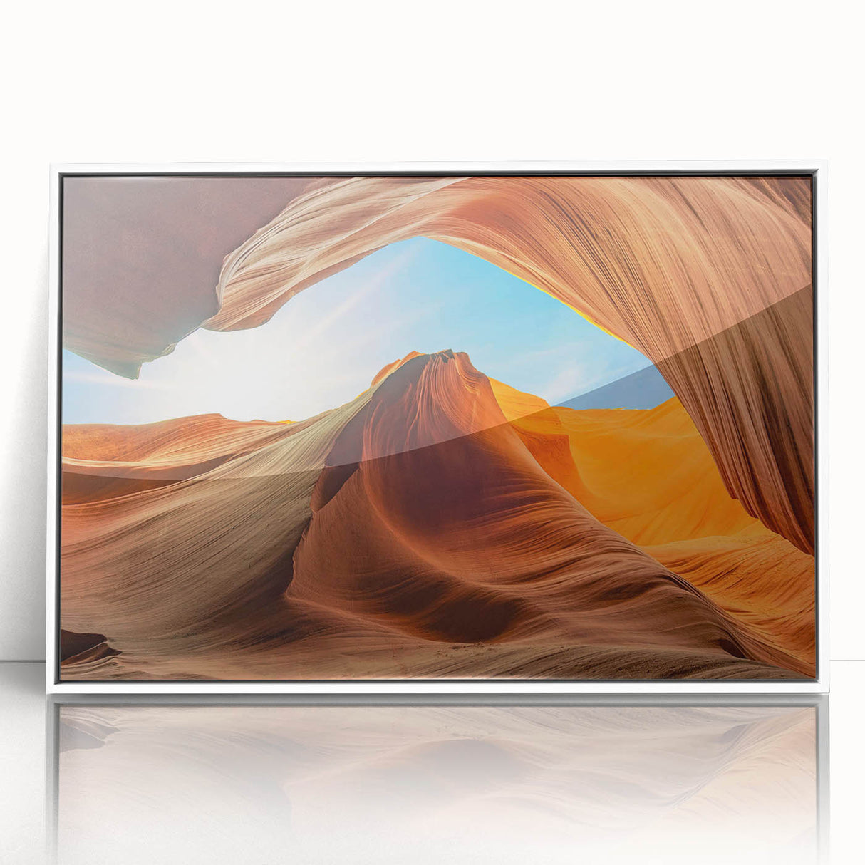 Framed acrylic wall art featuring a serene landscape with textured rock formations and soft color gradients, presented in a sleek white frame for modern decor.