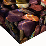 Close-up of a stretched canvas wall art piece showcasing a vibrant landscape design with multicolored rocks and textures, perfect for home decor enhancement.