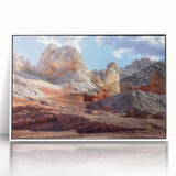 Framed wall art featuring a stunning landscape design showcasing vibrant rocks and natural elements, presented in a sleek white frame for elegant decor.