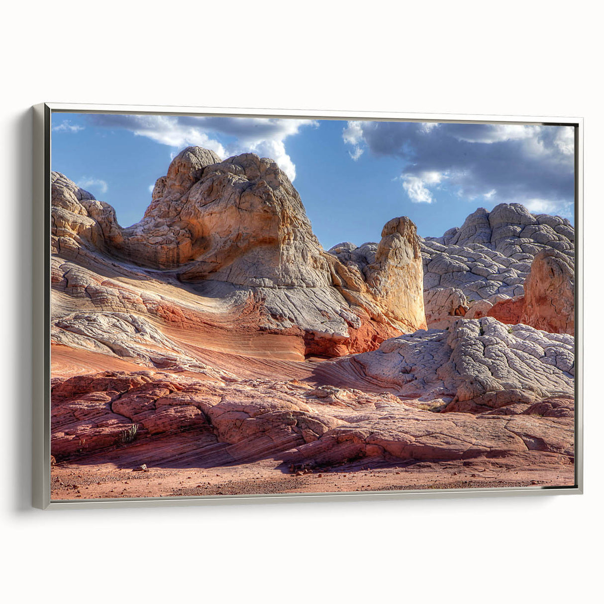 Framed canvas wall art showcasing a modern landscape design with rocks and natural textures, featuring a sleek silver frame, ideal for home decor enhancement.