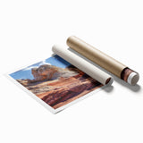 Abstract landscape wall art print featuring vibrant colors and textured rock formations, rolled and packaged in a protective cardboard tube for easy display.