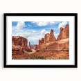 Framed wall art collection showcasing a scenic landscape with textured rocks, presented in a sleek black frame with a mat, perfect for modern decor.