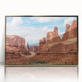 Framed wall art featuring a modern landscape design with rocky formations and gold accents, ideal for enhancing contemporary decor in living spaces.