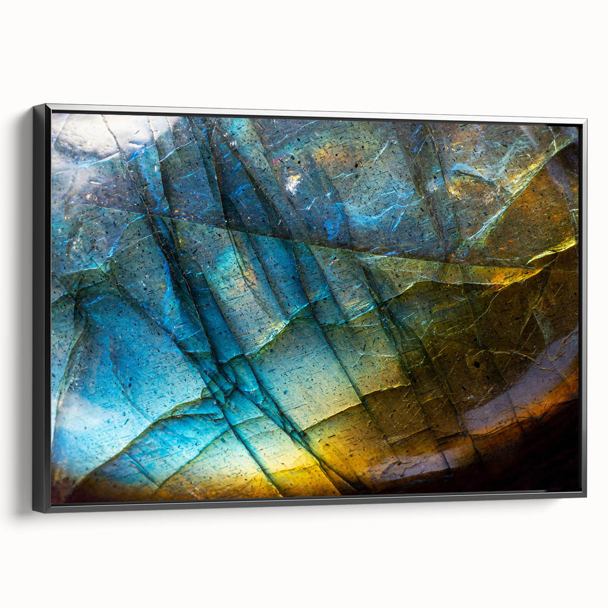 Framed canvas wall art showcasing a stunning landscape with rocky formations, featuring a sleek black frame and a side view that highlights its depth and texture. Ideal for modern home decor.