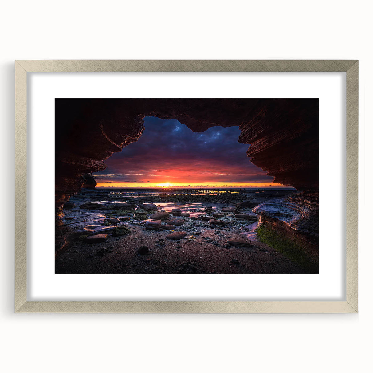 Framed wall art collection featuring a serene landscape with rocks, displayed in a silver mat frame. Ideal for modern home decor, enhancing interior aesthetics.