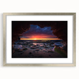 Framed wall art collection featuring a serene landscape with rocks, displayed in a silver mat frame. Ideal for modern home decor, enhancing interior aesthetics.