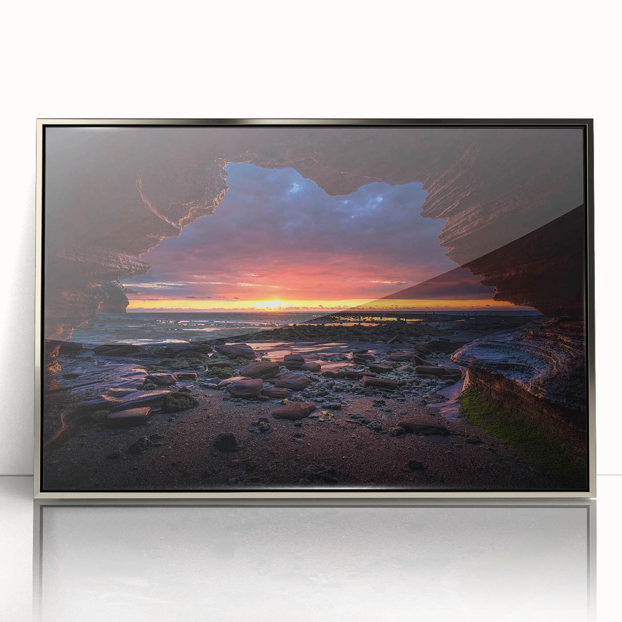 Framed wall art design showcasing a modern landscape with rocky formations, featuring a sleek silver frame and acrylic finish, ideal for contemporary decor.