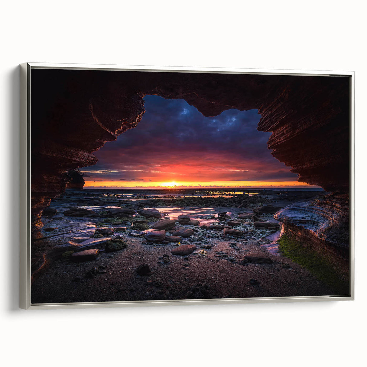 Framed canvas wall art showcasing a contemporary landscape design with textured rocks and vibrant colors, featuring a sleek silver frame, perfect for modern decor.