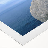 Rolled canvas wall art showcasing a serene landscape with rocky formations and vibrant colors, perfect for home decor or artistic inspiration, packaged securely.